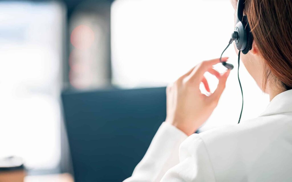Back view of a woman talking on a headset