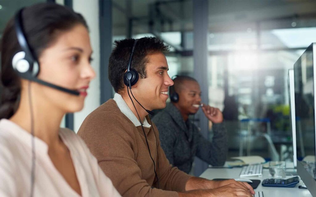 Shot of call centre agents working in an office. Shot of call centre agents working in an office.