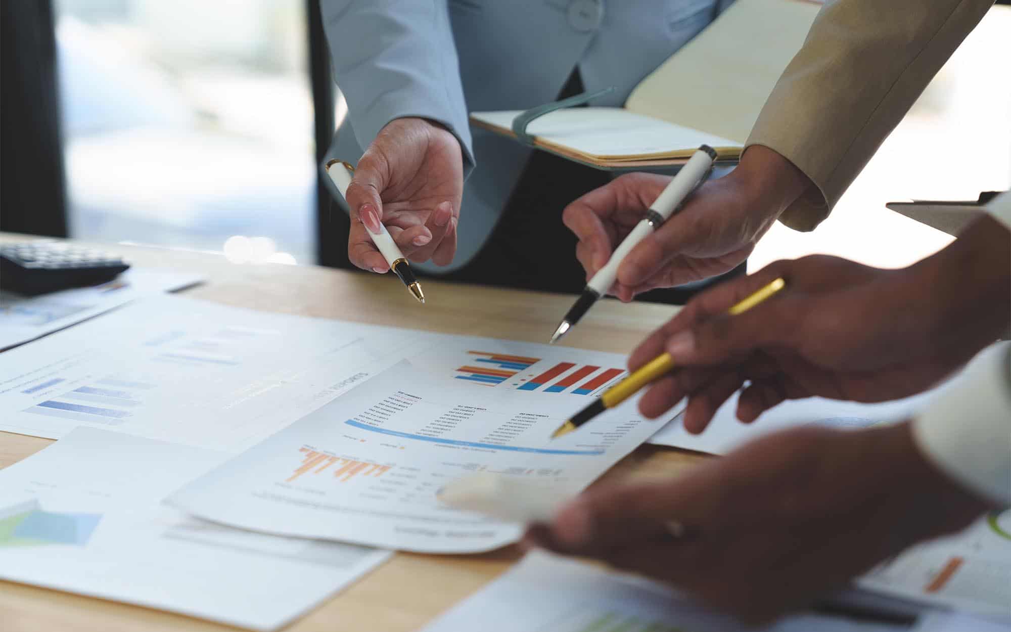 Business people looking at sales charts