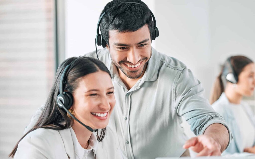Collaboration, woman and man with headset in call center for client help
