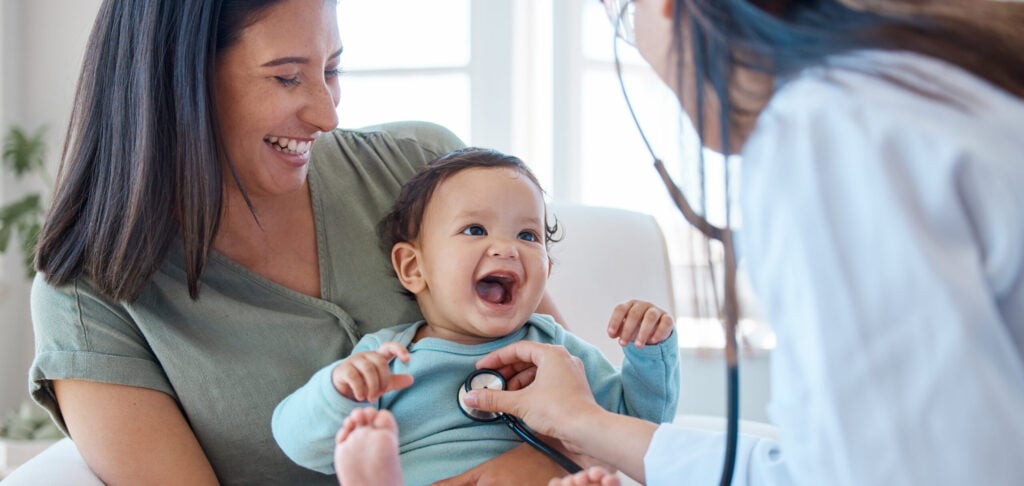 Mother, baby and stethoscope of pediatrician for healthcare consulting, check lungs and breathing for heartbeat. Doctor, happy infant kid and chest assessment in clinic, hospital and medical analysis